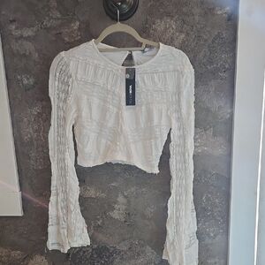 White Crop Top with Long Bell Sleeves and Ruffled Style